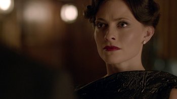 Movie still from “Sherlock” (2010), created by Steven Moffat – A person wearing a black shirt; Close Up shot, Over the shoulder angle