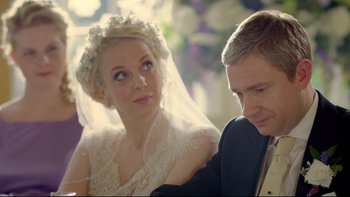 Movie still from “Sherlock” (2010), created by Steven Moffat – A man and a woman sitting next to each other; Close Up shot, Over the shoulder angle