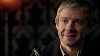 Movie still from “Sherlock” (2010), created by Steven Moffat – A person wearing a jacket; Close Up shot, Over the shoulder angle