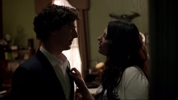 Movie still from “Sherlock” (2010), created by Steven Moffat – A man and a woman looking at one another; Close Up shot, Over the shoulder angle