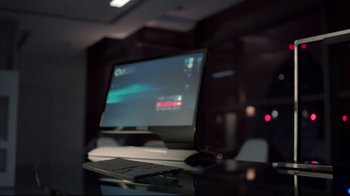 Movie still from “Sherlock” (2010), created by Steven Moffat – A desktop computer sitting on top of a desk; Extreme Close Up shot, High angle