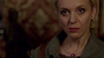 Movie still from “Sherlock” (2010), created by Steven Moffat – A person wearing a necklace; Close Up shot, Over the shoulder angle