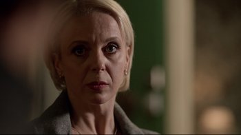 Movie still from “Sherlock” (2010), created by Steven Moffat – A person with short blonde hair; Close Up shot, Over the shoulder angle