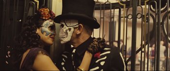 Movie still from “Spectre” (2015), directed by Sam Mendes – A man in a top hat with a skull painted on his face; Close Up shot, Low angle