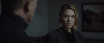 Movie still from “Spectre” (2015), directed by Sam Mendes – A woman in a black jacket looking at a man in a black suit; Close Up shot, Over the shoulder angle