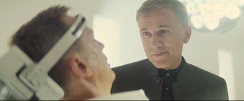 Movie still from “Spectre” (2015), directed by Sam Mendes – A man looking at himself in the mirror; Close Up shot, Over the shoulder angle