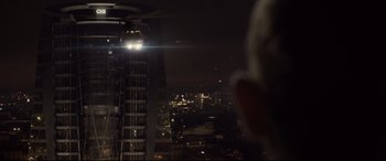 Movie still from “Spectre” (2015), directed by Sam Mendes – A view of a city at night from a building; Extreme Wide shot, Over the shoulder angle
