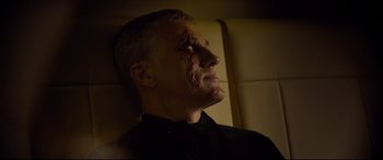 Movie still from “Spectre” (2015), directed by Sam Mendes – A man with a scar on his face; Close Up shot, High angle