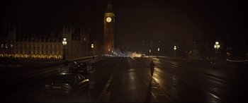 Movie still from “Spectre” (2015), directed by Sam Mendes – A person walking down a street at night; Extreme Wide shot, Low angle