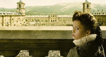 Movie still from “Elizabeth: The Golden Age” (2007), directed by Shekhar Kapur – A young boy looking out at a castle; Medium shot, High angle