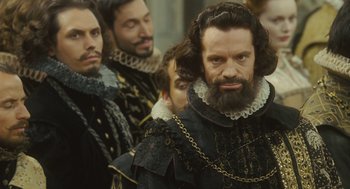 Movie still from “Elizabeth: The Golden Age” (2007), directed by Shekhar Kapur – A group of men standing next to each other; Close Up shot, Over the shoulder angle