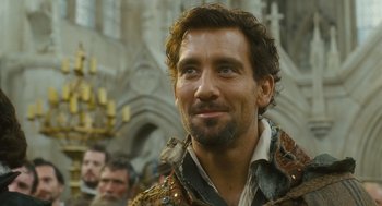 Movie still from “Elizabeth: The Golden Age” (2007), directed by Shekhar Kapur – A person with a beard; Close Up shot, Over the shoulder angle