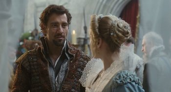 Movie still from “Elizabeth: The Golden Age” (2007), directed by Shekhar Kapur – A man and a woman in medieval garb talking to each other; Close Up shot, Over the shoulder angle