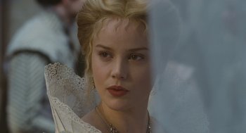 Movie still from “Elizabeth: The Golden Age” (2007), directed by Shekhar Kapur – A person wearing a dress; Close Up shot, Over the shoulder angle