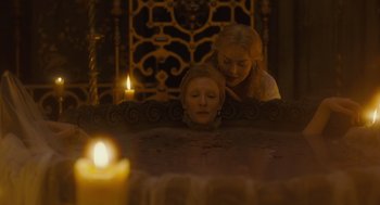 Movie still from “Elizabeth: The Golden Age” (2007), directed by Shekhar Kapur – Two women looking at each other through a mirror; Medium shot, High angle