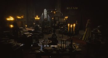 Movie still from “Elizabeth: The Golden Age” (2007), directed by Shekhar Kapur – Many candles lit in the dark room; Extreme Wide shot, High angle
