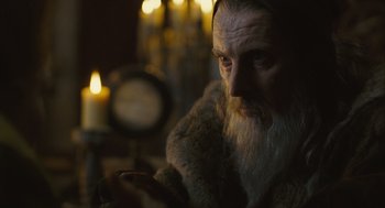 Movie still from “Elizabeth: The Golden Age” (2007), directed by Shekhar Kapur – An old man with long white hair and a long beard; Close Up shot, Over the shoulder angle
