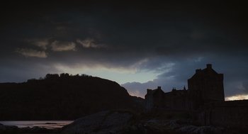 Movie still from “Elizabeth: The Golden Age” (2007), directed by Shekhar Kapur – A dark sky over a castle and a body of water; Extreme Wide shot, Low angle