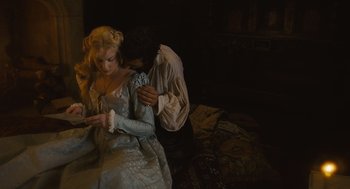 Movie still from “Elizabeth: The Golden Age” (2007), directed by Shekhar Kapur – A man and a woman dressed in period clothing; Medium shot, High angle