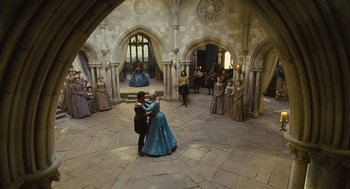Movie still from “Elizabeth: The Golden Age” (2007), directed by Shekhar Kapur – A couple of people that are dancing in a room; Wide shot, High angle