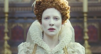 Movie still from “Elizabeth: The Golden Age” (2007), directed by Shekhar Kapur – A woman in a white dress with a white wig on; Close Up shot, Low angle