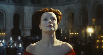 Movie still from “Elizabeth: The Golden Age” (2007), directed by Shekhar Kapur – A woman in a red dress looking up at the sky; Close Up shot, Low angle
