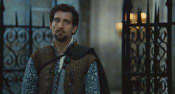 Movie still from “Elizabeth: The Golden Age” (2007), directed by Shekhar Kapur – A person wearing a vest; Close Up shot, Over the shoulder angle