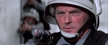 Movie still from “Star Wars: Episode IV - A New Hope” (1977), directed by George Lucas – A person wearing a helmet; Close Up shot, Low angle