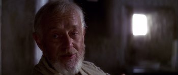 Movie still from “Star Wars: Episode IV - A New Hope” (1977), directed by George Lucas – An old man with a beard and a white beard; Close Up shot, Over the shoulder angle