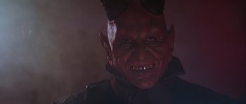 Movie still from “Star Wars: Episode IV - A New Hope” (1977), directed by George Lucas – The face of an evil looking demon; Close Up shot, High angle