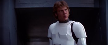 Movie still from “Star Wars: Episode IV - A New Hope” (1977), directed by George Lucas – A person wearing a costume; Close Up shot, Low angle