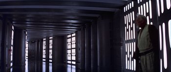 Movie still from “Star Wars: Episode IV - A New Hope” (1977), directed by George Lucas – A dark room with pillars and windows in it; Extreme Wide shot, High angle