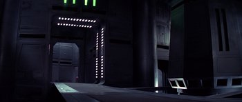 Movie still from “Star Wars: Episode IV - A New Hope” (1977), directed by George Lucas – A building that has some lights on it; Extreme Wide shot, Low angle