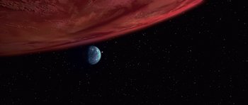 Movie still from “Star Wars: Episode IV - A New Hope” (1977), directed by George Lucas – An image of an exoplanet in the space; Extreme Wide shot, Overhead angle
