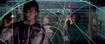 Movie still from “Star Wars: Episode IV - A New Hope” (1977), directed by George Lucas – A group of people standing next to each other in a room; Medium shot, Low angle