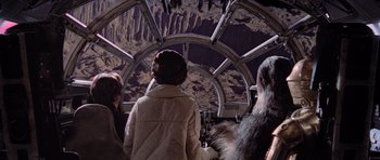 Movie still from “Star Wars: Episode V - The Empire Strikes Back” (1980), directed by Irvin Kershner – A group of people inside of an airplane; Medium shot, Low angle