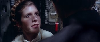 Movie still from “Star Wars: Episode V - The Empire Strikes Back” (1980), directed by Irvin Kershner – A woman looking at a man in a room; Close Up shot, Over the shoulder angle