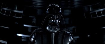 Movie still from “Star Wars: Episode V - The Empire Strikes Back” (1980), directed by Irvin Kershner – A darth vader statue in a dark room; Close Up shot, Low angle