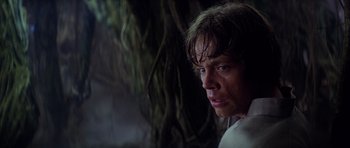Movie still from “Star Wars: Episode V - The Empire Strikes Back” (1980), directed by Irvin Kershner – A young man is looking into the distance; Close Up shot, Low angle