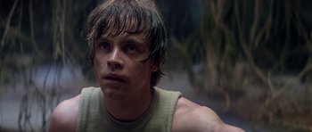 Movie still from “Star Wars: Episode V - The Empire Strikes Back” (1980), directed by Irvin Kershner – A young man with wet hair looking into the distance; Close Up shot, Low angle