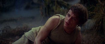 Movie still from “Star Wars: Episode V - The Empire Strikes Back” (1980), directed by Irvin Kershner – A man laying on the ground in the dirt; Close Up shot, Low angle