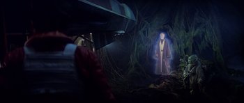 Movie still from “Star Wars: Episode V - The Empire Strikes Back” (1980), directed by Irvin Kershner – A man standing in the dark in front of a tree; Wide shot, Over the shoulder angle