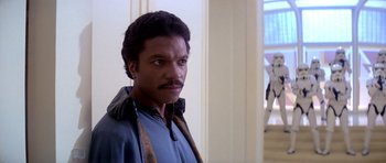 Movie still from “Star Wars: Episode V - The Empire Strikes Back” (1980), directed by Irvin Kershner – A person wearing a jacket; Close Up shot, Over the shoulder angle