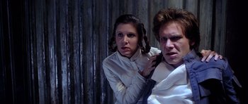 Movie still from “Star Wars: Episode V - The Empire Strikes Back” (1980), directed by Irvin Kershner – A woman and a young man are posing for a picture; Close Up shot, Low angle