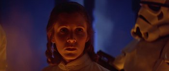 Movie still from “Star Wars: Episode V - The Empire Strikes Back” (1980), directed by Irvin Kershner – A young woman is looking into the camera; Close Up shot, Low angle