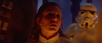 Movie still from “Star Wars: Episode V - The Empire Strikes Back” (1980), directed by Irvin Kershner – A young girl with braids looking up at the sky; Close Up shot, Low angle