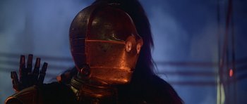Movie still from “Star Wars: Episode V - The Empire Strikes Back” (1980), directed by Irvin Kershner – The face of a person wearing a metal helmet; Close Up shot, Low angle