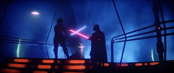 Movie still from “Star Wars: Episode V - The Empire Strikes Back” (1980), directed by Irvin Kershner – A couple of people that are holding light sabers; Wide shot, Overhead angle