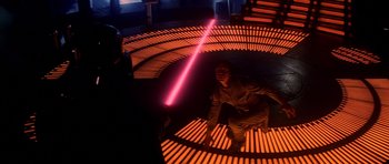 Movie still from “Star Wars: Episode V - The Empire Strikes Back” (1980), directed by Irvin Kershner – A man is holding a light saber in the dark; Wide shot, High angle