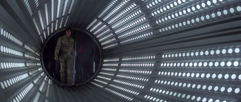 Movie still from “Star Wars: Episode V - The Empire Strikes Back” (1980), directed by Irvin Kershner – A person is standing in a tunnel looking up; Wide shot, Low angle